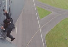 Watch Tom Cruise hang onto the side of a flying plane for Mission: Impossible Rogue Nation