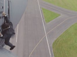 Watch Tom Cruise hang onto the side of a flying plane for Mission: Impossible Rogue Nation