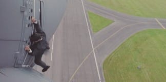 Watch Tom Cruise hang onto the side of a flying plane for Mission: Impossible Rogue Nation